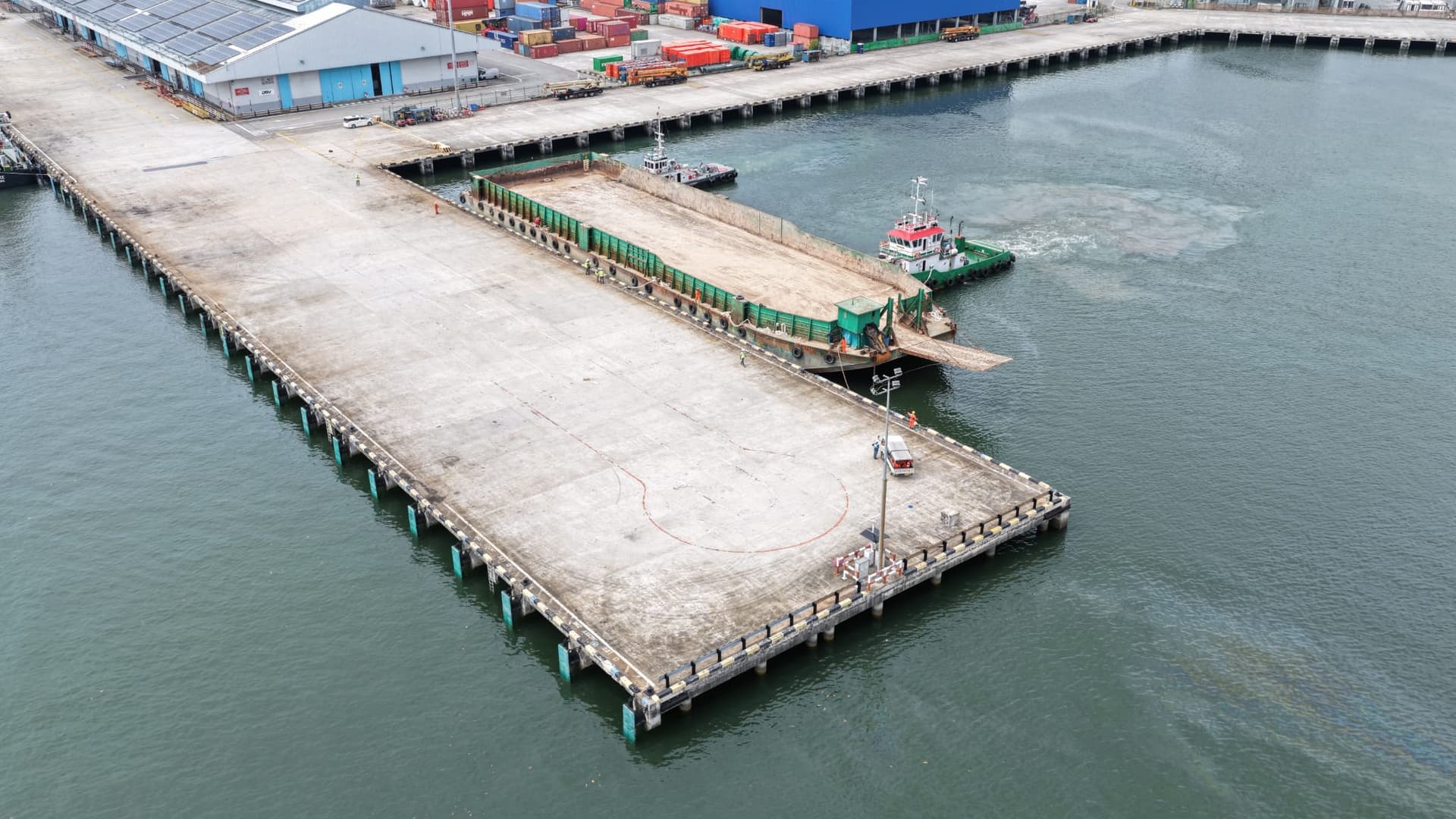 Berth J1 jetty with barge docked at Jurong Port